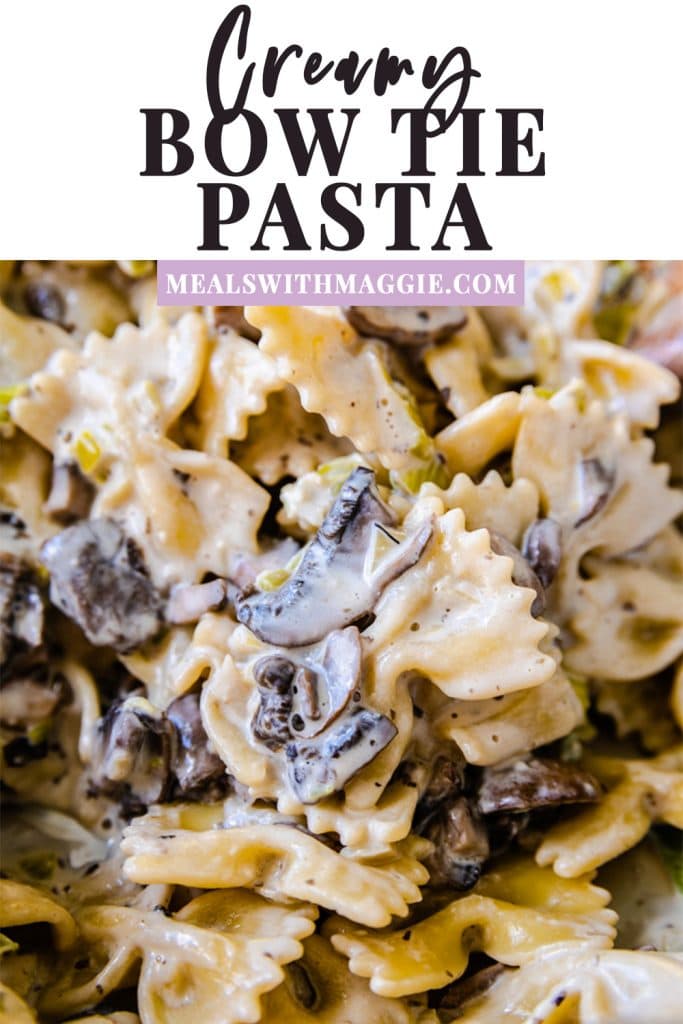 creamy bow tie pasta with mushroom and leek pieces and text above it.