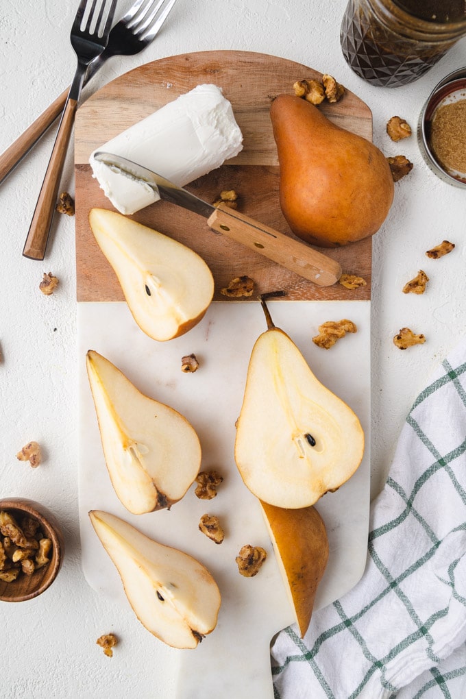 pears and walnuts on a serving platter. 