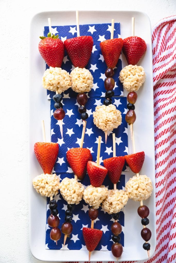 fruit skewers with strawberries, blueberries and Rice Krispie balls