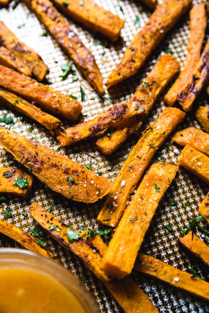 sweet potato fries with salt and parsley on them. 