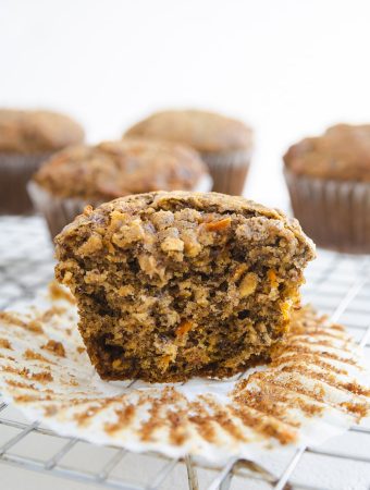 carrot apple breakfast muffins with a bite taken out of it.