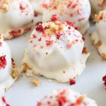 a strawberry shortcake bite on a plate with graham cracker.