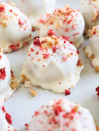 a strawberry shortcake bite on a plate with graham cracker.