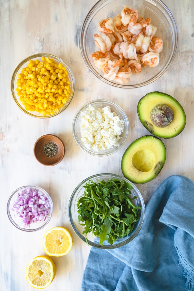 ingredients for salad in separate bowls.