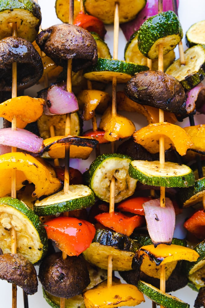 Grilled vegetable kabobs on wooden skewers. 