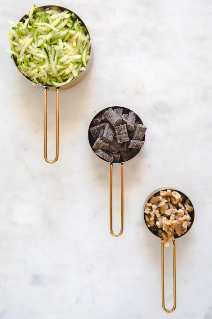 ingredients in measuring cups for paleo zucchini bread.