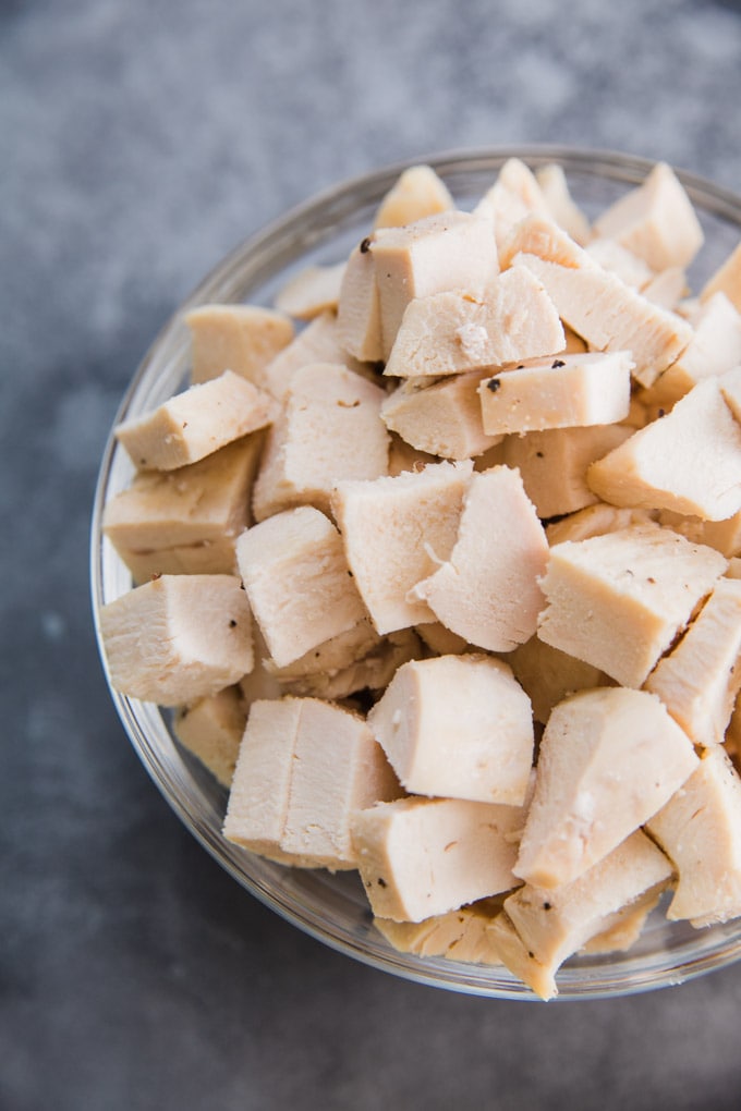 a bowl of cooked chicken breasts. 