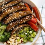 mushroom stir fry in a bowl with a fork.