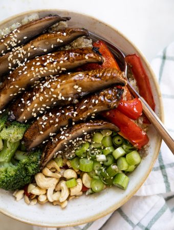 mushroom stir fry in a bowl with a fork.