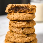 stack of peanut butter cookies with a bite mark.