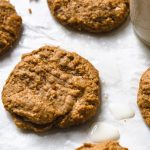 peanut butter cookies on a sheet pan with milk