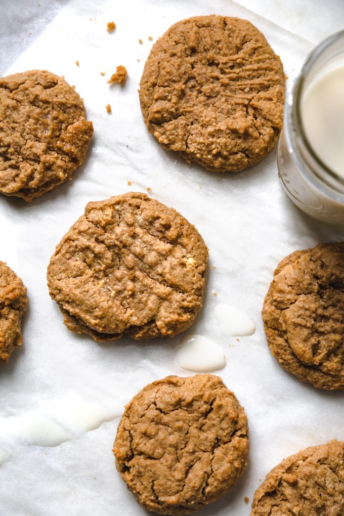 Cookies with milk splashed around them.