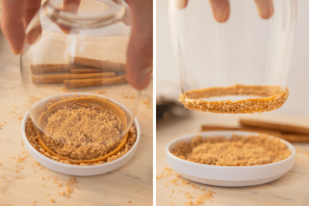 a glass being dunked with peanut butter and sugar on the rim.