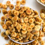 ranch seasoning oyster crackers overflowing out of a bowl.