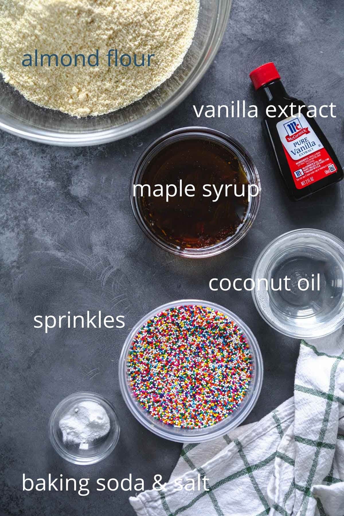 ingredients for holiday sprinkle cookies with labels displayed out. 