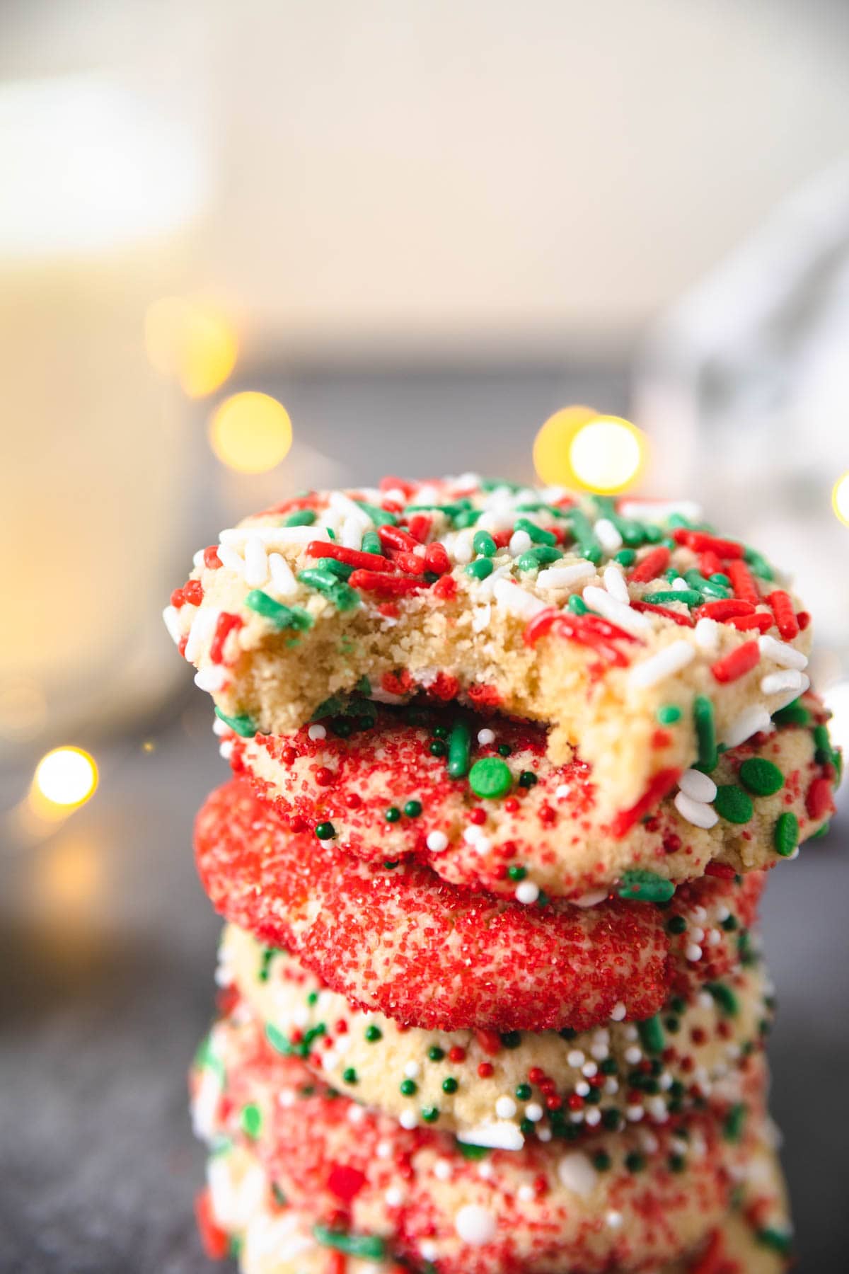 an eggless sugar cookie with a bite taken out of it showing the soft and chewy middle.